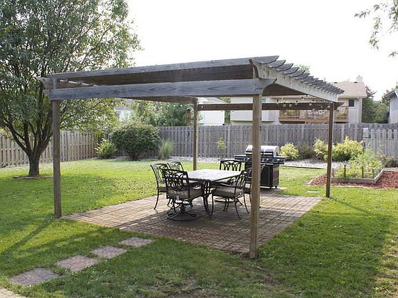 Pergola, raised garden, and landscaping