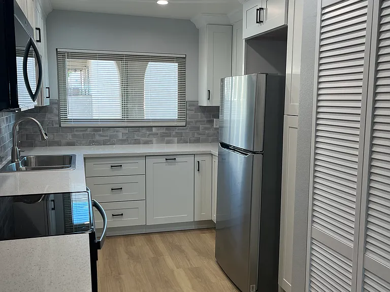 Full size Washer/Dryer behind bi-fold door