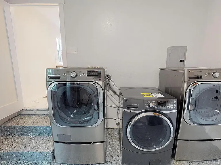 Laundry room with 2 washers and 2 dryers