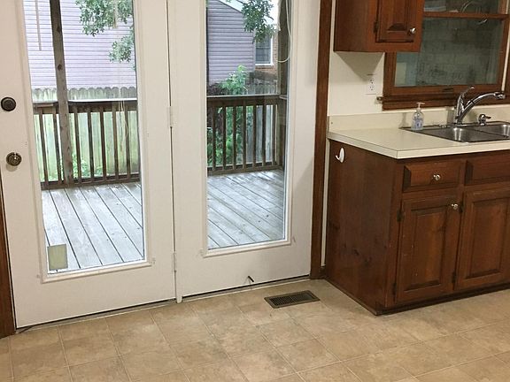 Kitchen with screened in porch.  
