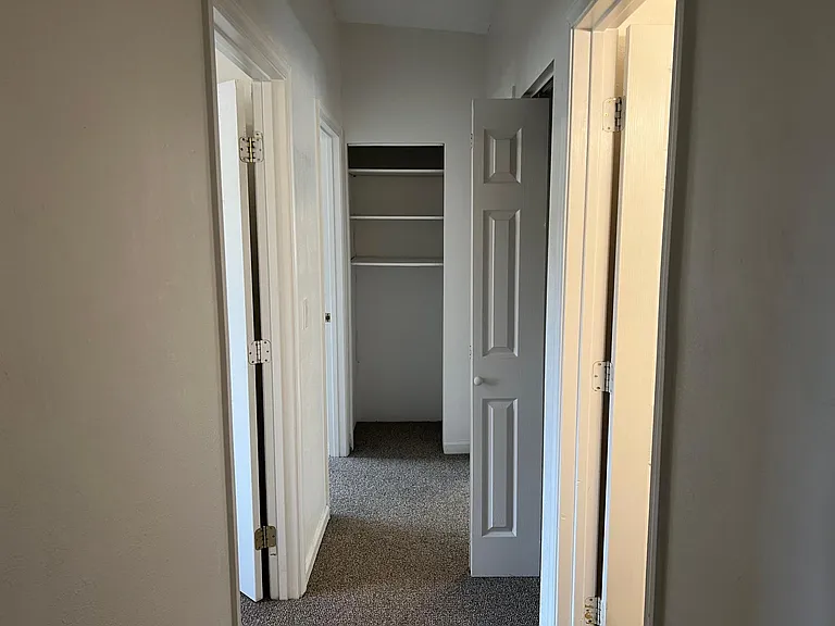 a hallway to the bedrooms