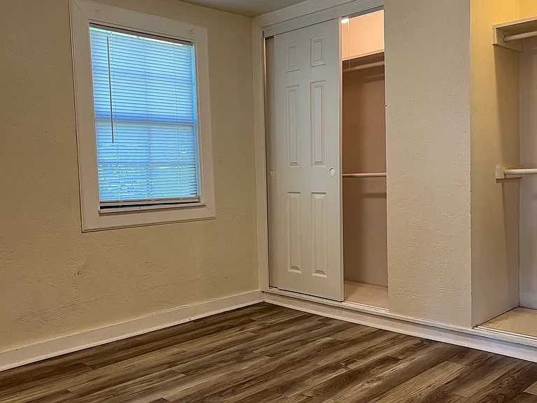 Main bedroom with extra large lighted closets with sliding doors.
