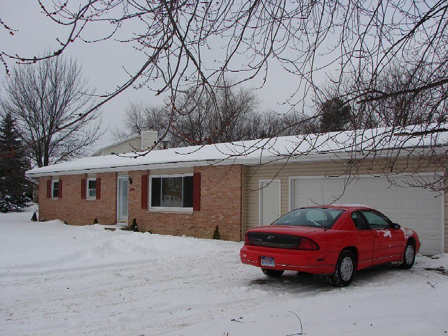 Brick & Vinyl Ranch Attached 2 Car Garage
