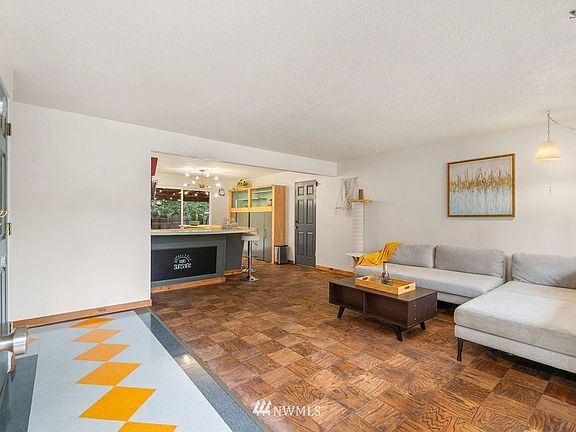  Featuring a spacious floor plan, fresh interior paint,baseboards, and restored hardwood floors. 