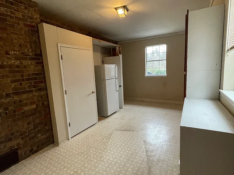 Bonus Room (w/ shelves, storage space, and extra refrigerator)