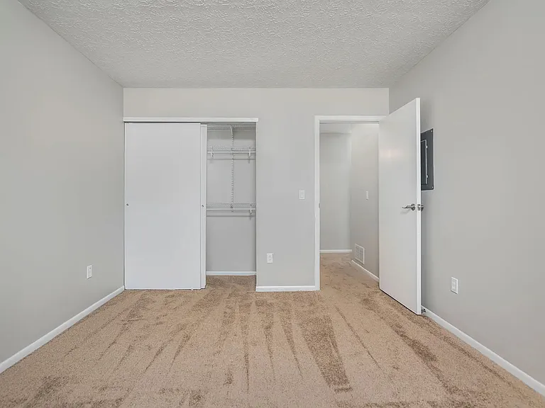 Bedroom with lush carpet