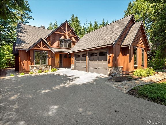Front of Home. Enjoy the wrap-around landscaping and stone walkway!