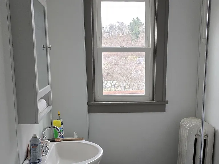 New sink, toilet, medicine cabinet and floor.