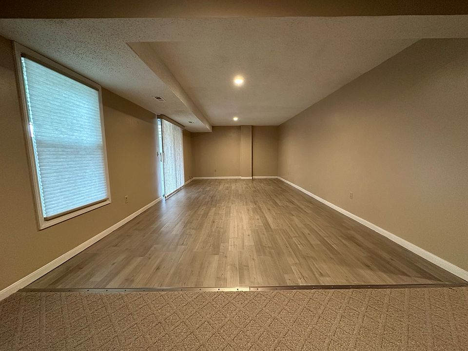 Entertainment or family room on lower level along with two bedrooms and one bathroom