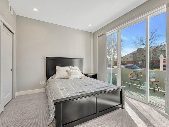 Bedroom with walk-out patio, entry level