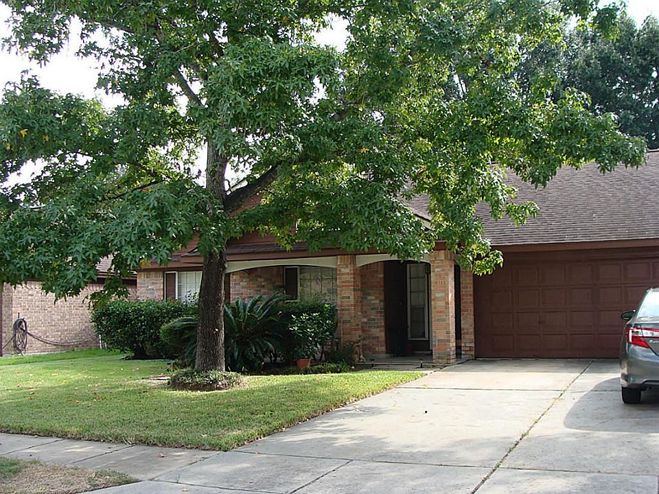 View of the front shows the additional surface parking in front of the attached double garage.