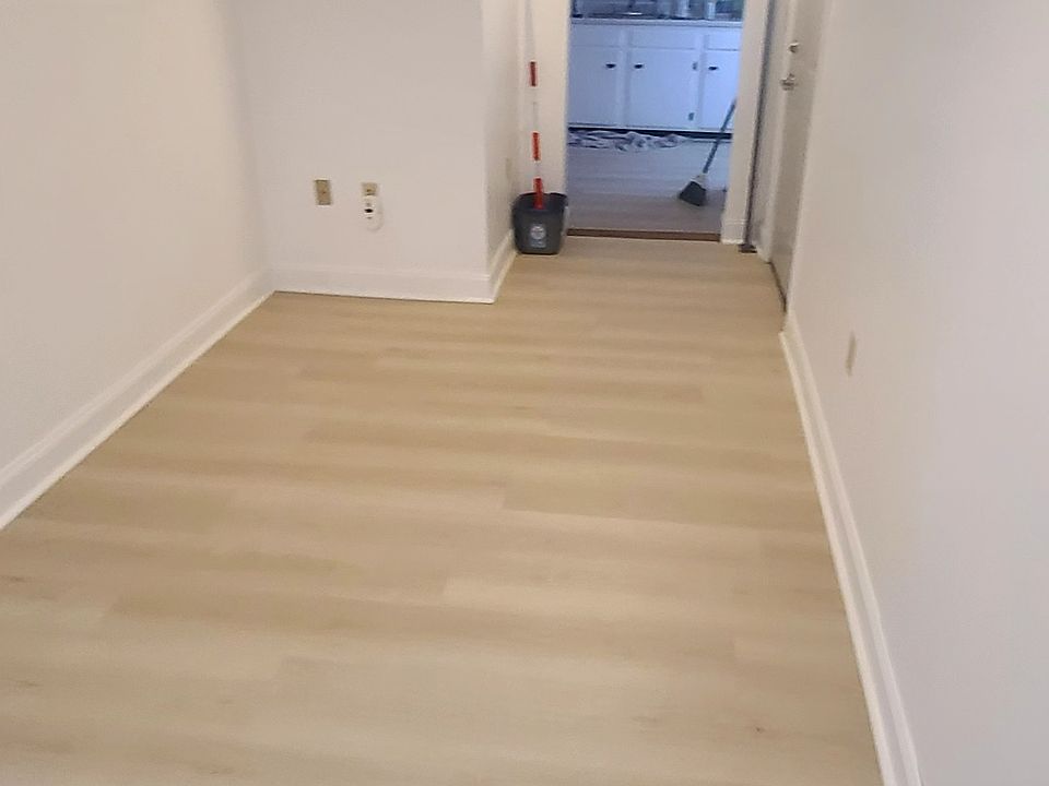 Living room with entrance to kitchen