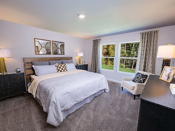 The primary suite offers a nice retreat. Photography from Holland Park.