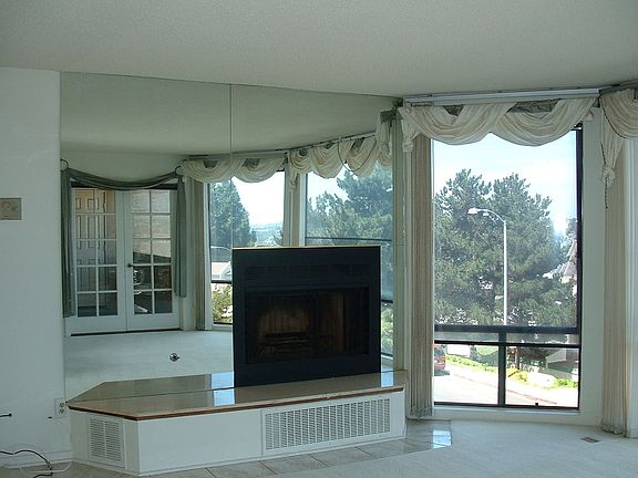 fireplace and mirrored walls