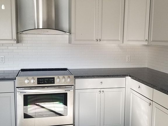 Exterior Vented Exhaust Hood, Granite Counters, Tile Backsplash