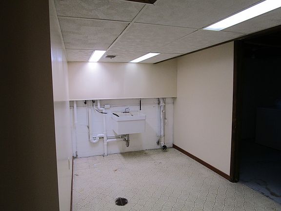 Laundry room is large with plenty of light.