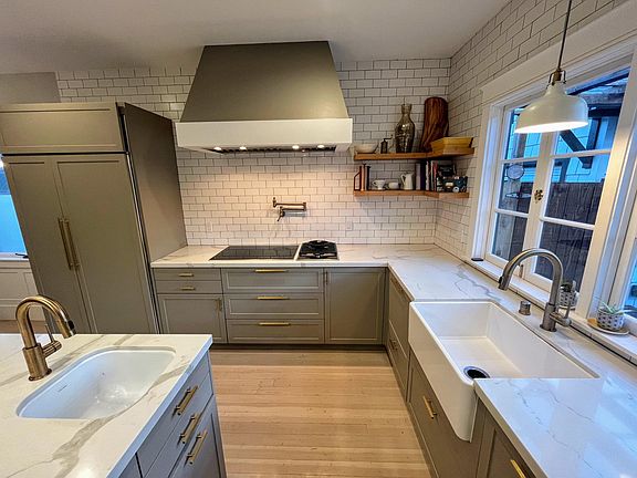 Kitchen has wolf and subzero appliances, two sinks, and two dishwashers