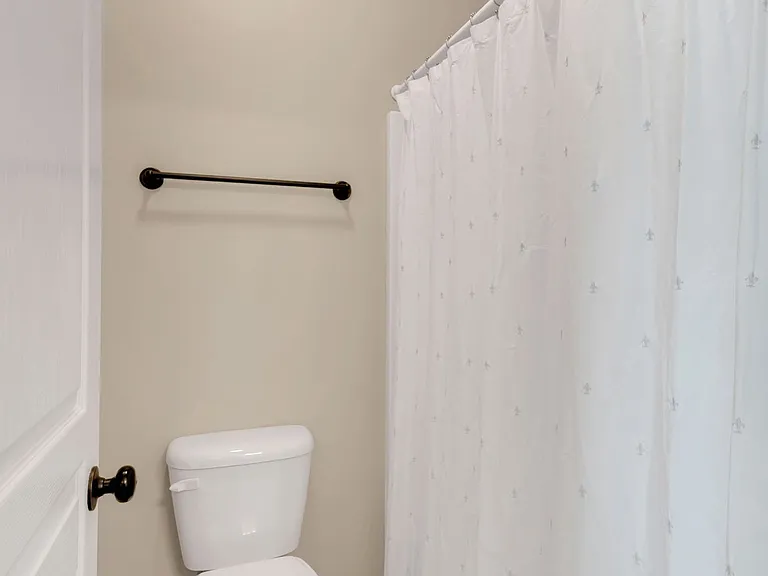 Jack and Jill bath includes tub with shower
