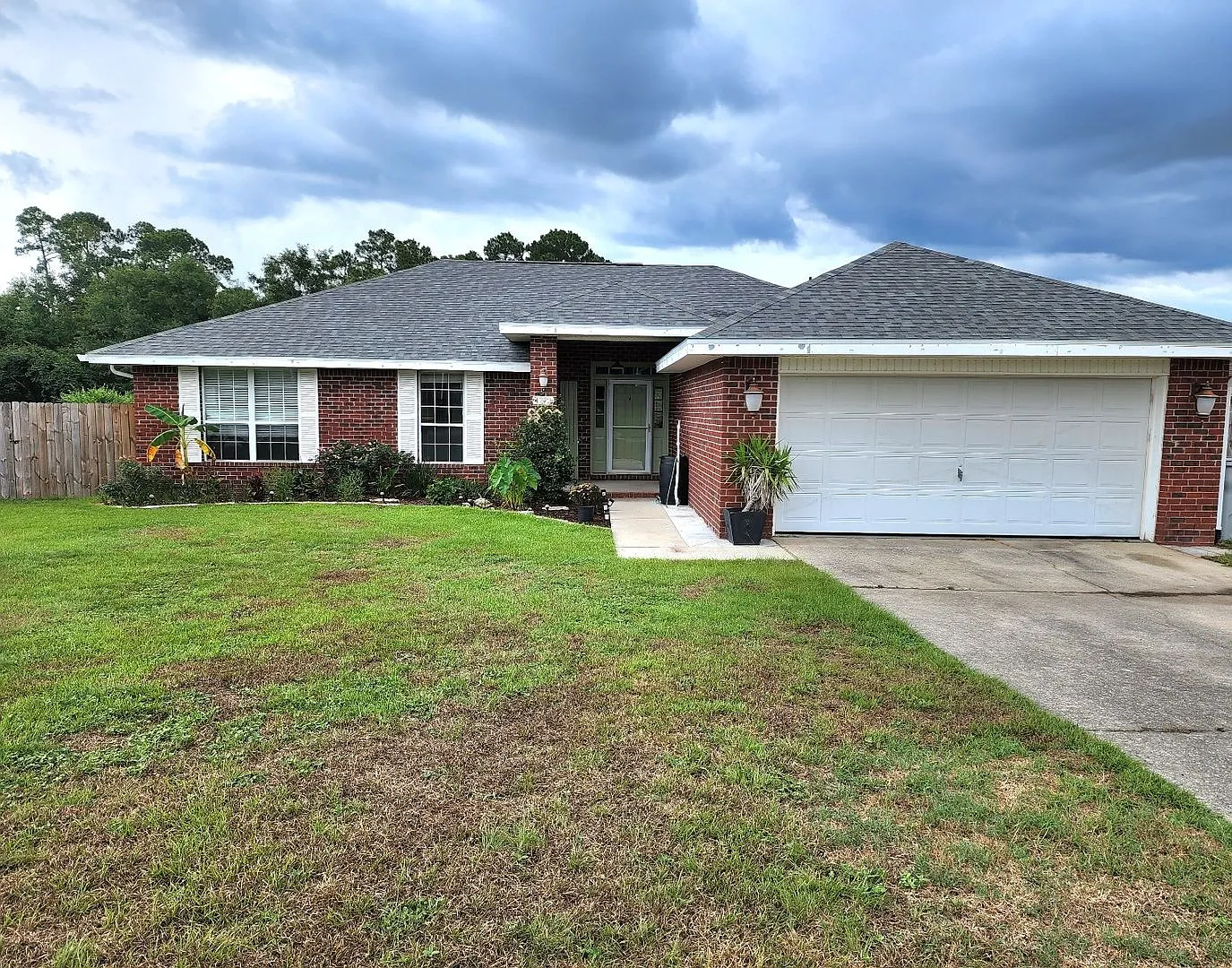 Adorably Styled and Updated 4 bedroom 2 bath Brick home located in Pace Community of La Floresta! — Photo 1