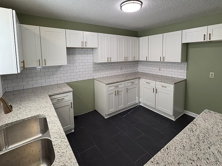 Kitchen appliances installed since picture was taken.