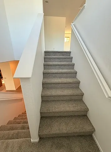 On stairs landing.