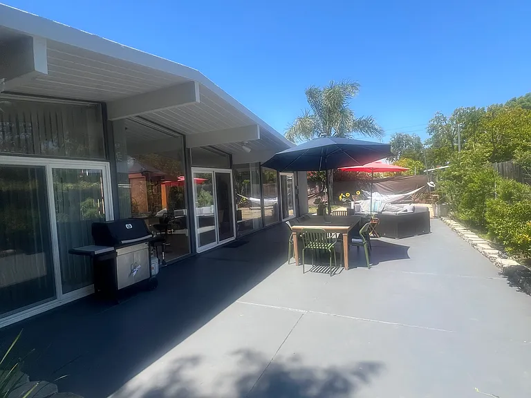 Step out from your living area into a private backyard retreat_perfect for hosting a BBQ on the grill, unwinding by the fire pit, or enjoying a peaceful evening in the hammock under the stars.
