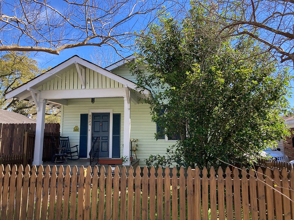 Front of house and fenced yard