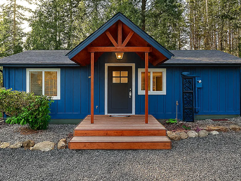 Step into comfort_this charming blue cabin welcomes you with warm wood accents and peaceful forest vibes
