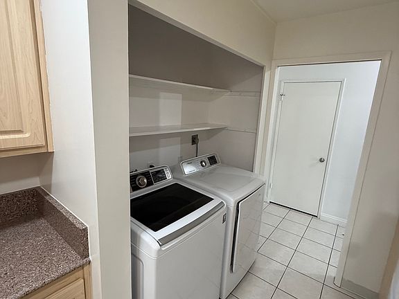 service room with washer and dryer