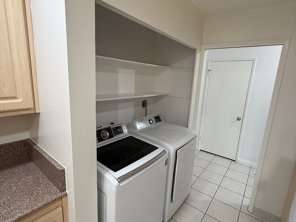 service room with washer and dryer