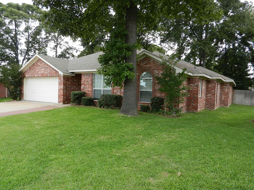 Large, mature trees & extended brick for additional parking in front