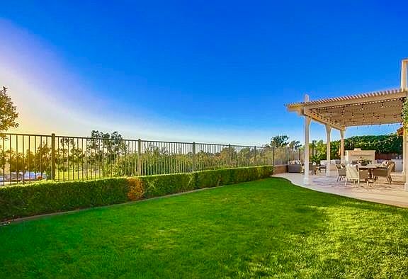 Fully fenced in backyard with spectacular views of the ocean and golf course