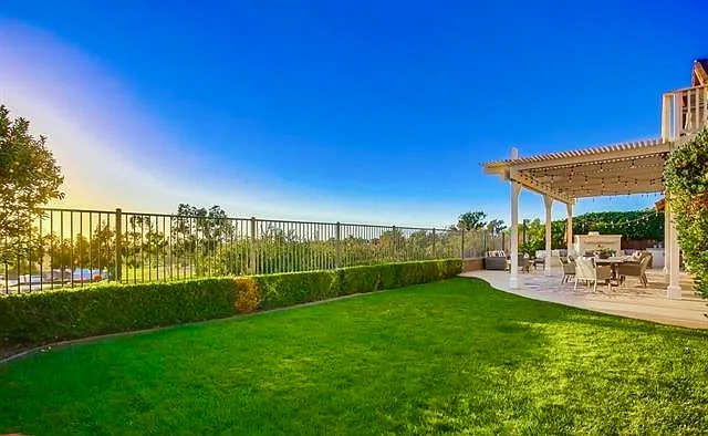 Fully fenced in backyard with spectacular views of the ocean and golf course