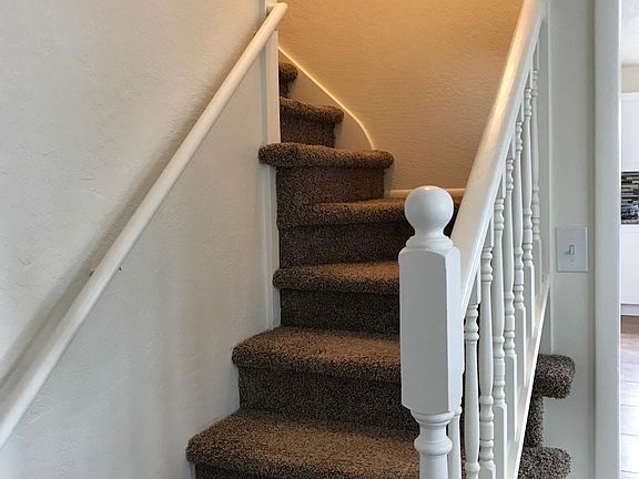 Stair case to upper 2 bedrooms.