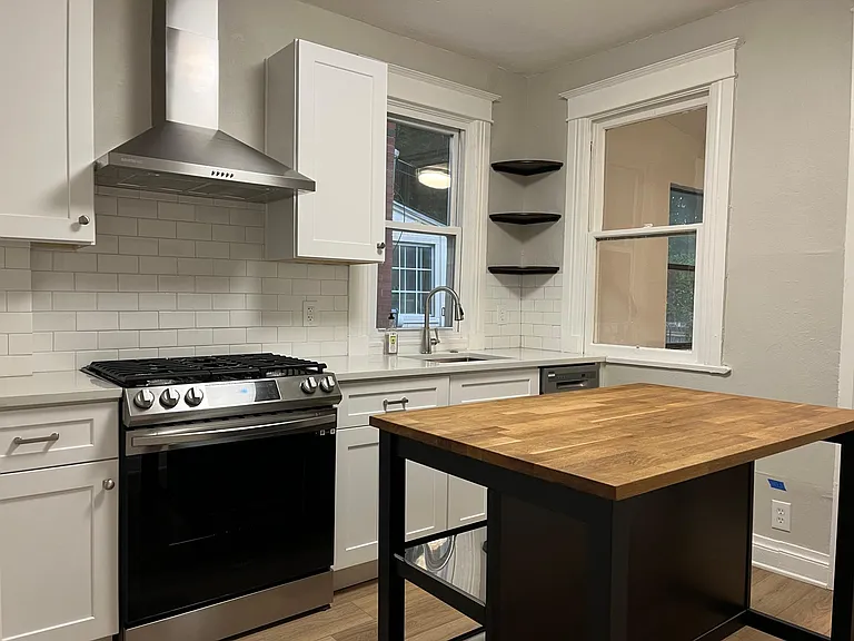 Kitchen includes all new appliances, quartz countertops, gas range with hood vent.