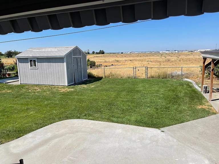 Back yard with shed and carport