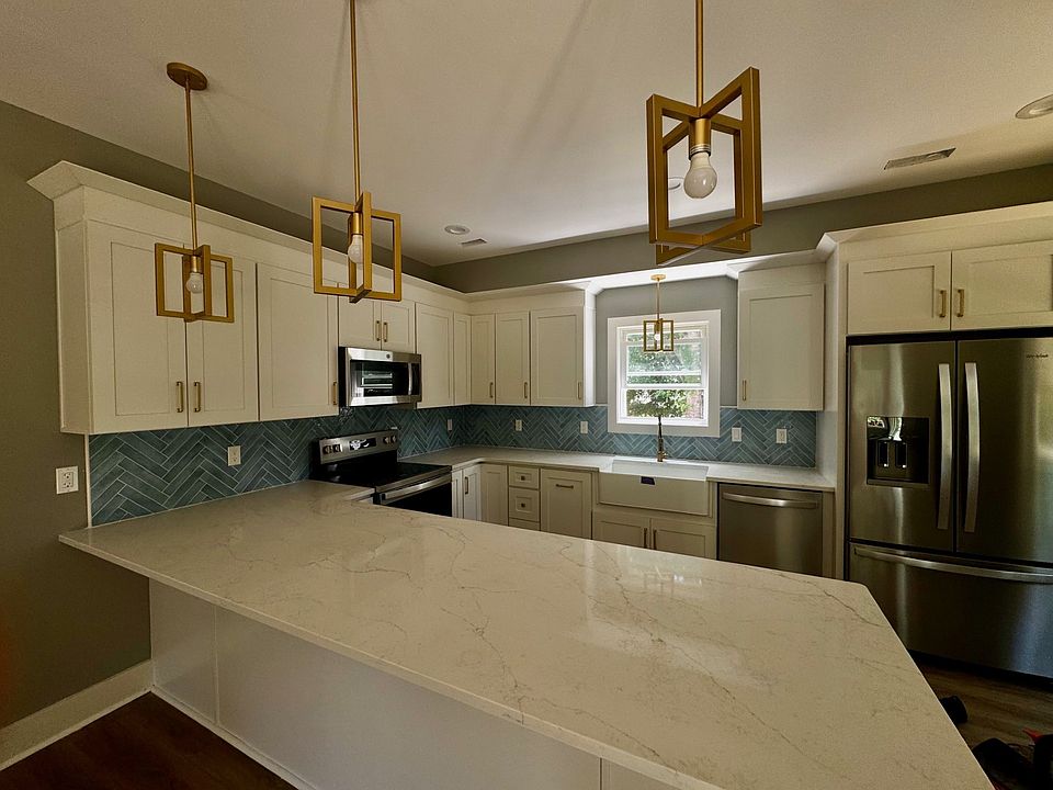 Kitchen with quartz counter tops and tile back splash