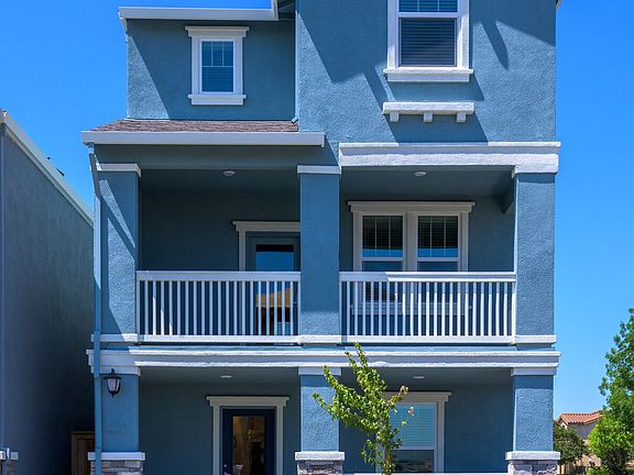 Impressive covered patios a 3 4 lite door add to the curb appeal of this home
