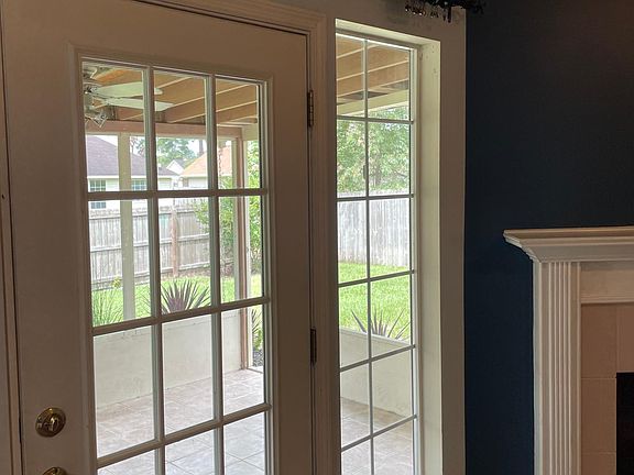 Living Room has lovely windows with view of screened porch and backyard