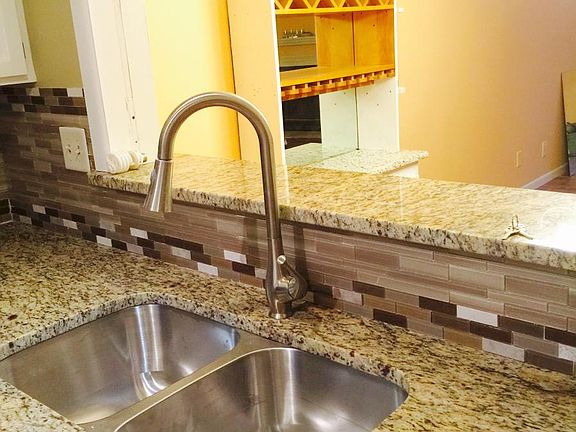 Kitchen with new sink and granite