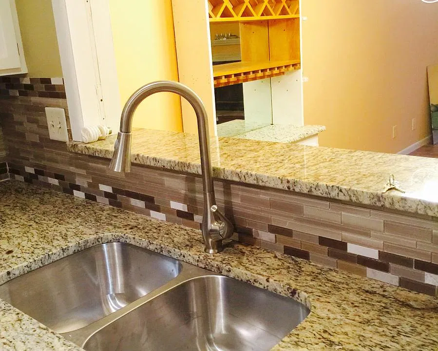 Kitchen with new sink and granite