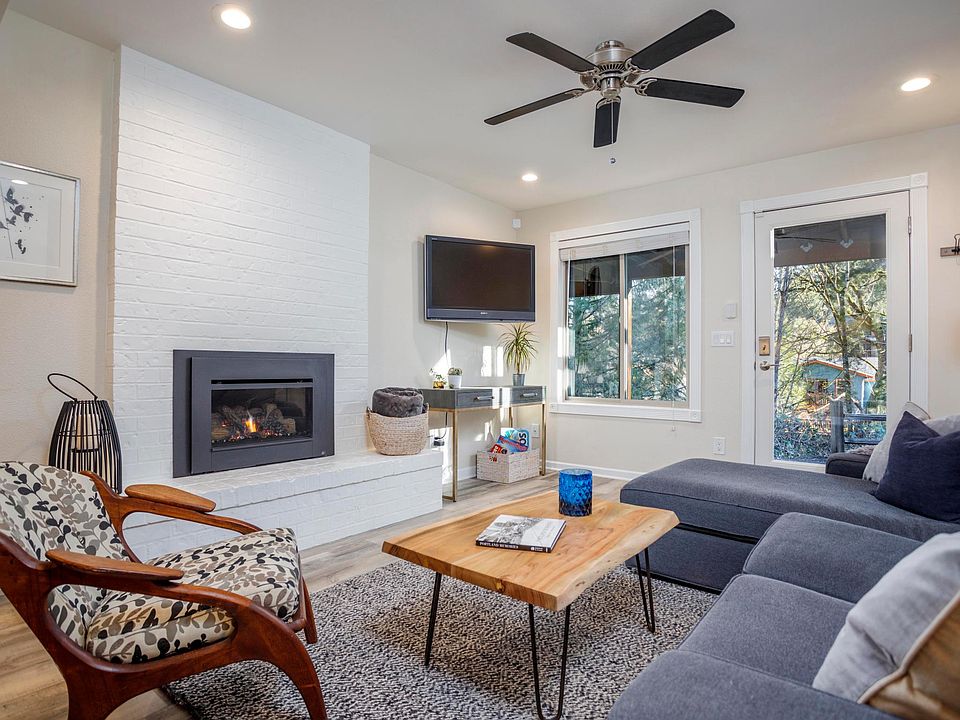 Living room with gas fireplace, TV, Cable, etc.