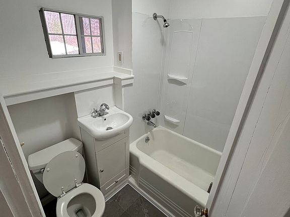 Bathroom with full tub/shower.