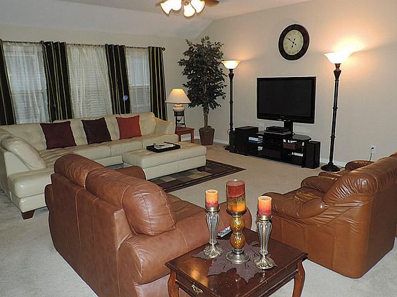 Incredible Oversized Den with Walls of Windows Open to Kitchen/Dining area!