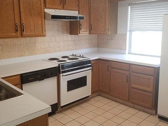 Dishwasher, refrigerator, and cabinet handles have been replaced. Refrigerator to right of picture is in garage in basement and still functioning.