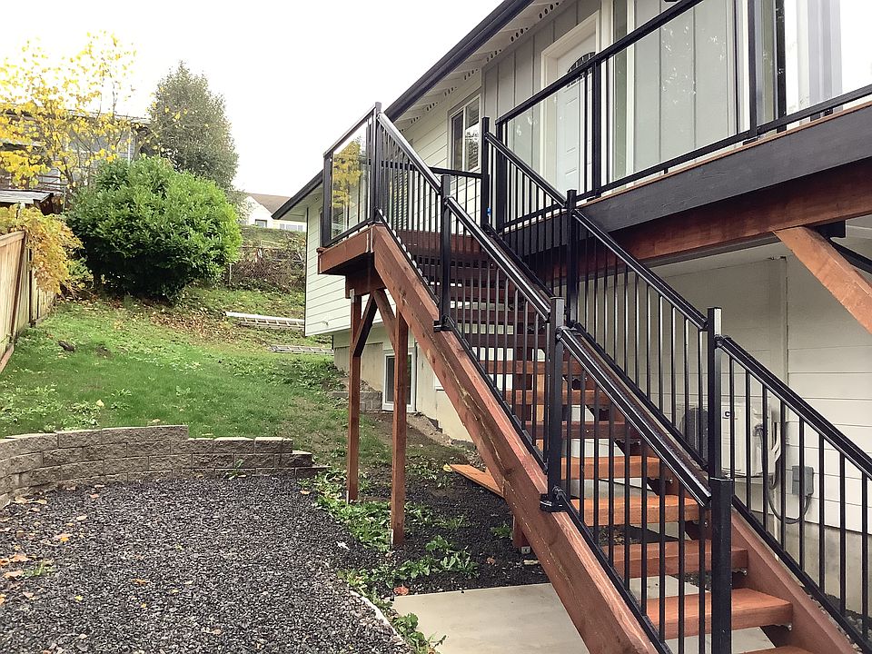 Stairway to porch and living room/kitchen area