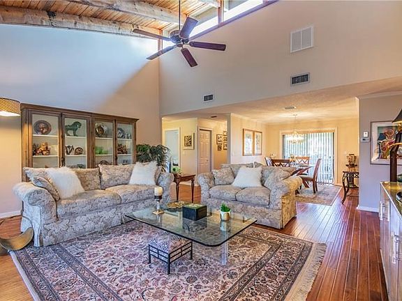 Gorgeous and spacious living area with soaring ceilings.