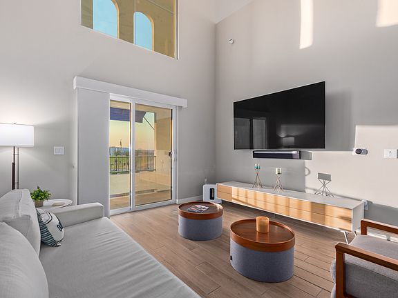 Beautiful Living room with tall ceilings and view.