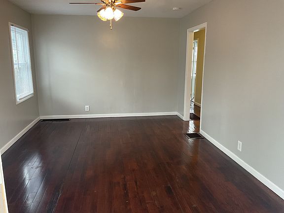 Spacious Living Room with Ceiling Fan.