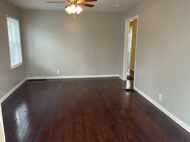 Spacious Living Room with Ceiling Fan.